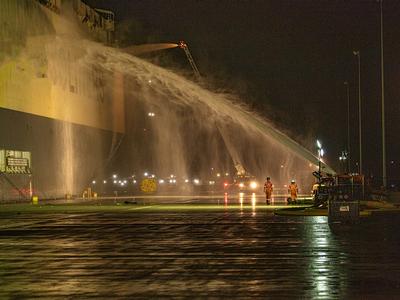 Firefighting crews spraying a car carrier during 24-hour Jacksonville OPA-90 response